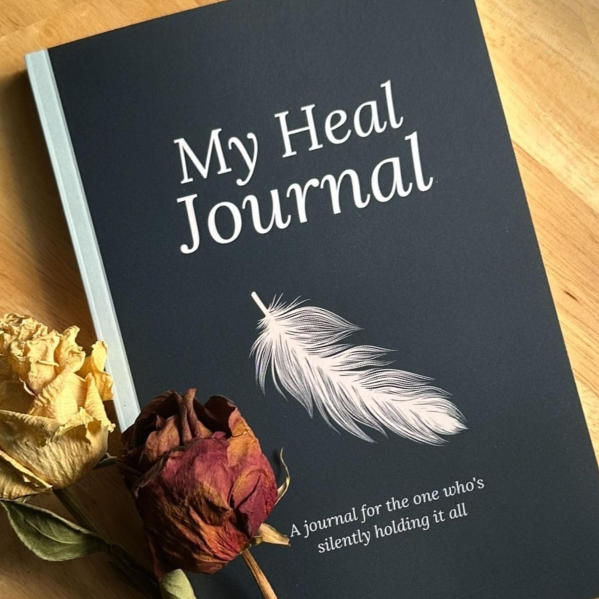 My Heal Journal physical guided healing journal for burnout and emotional exhaustion close up with dried roses