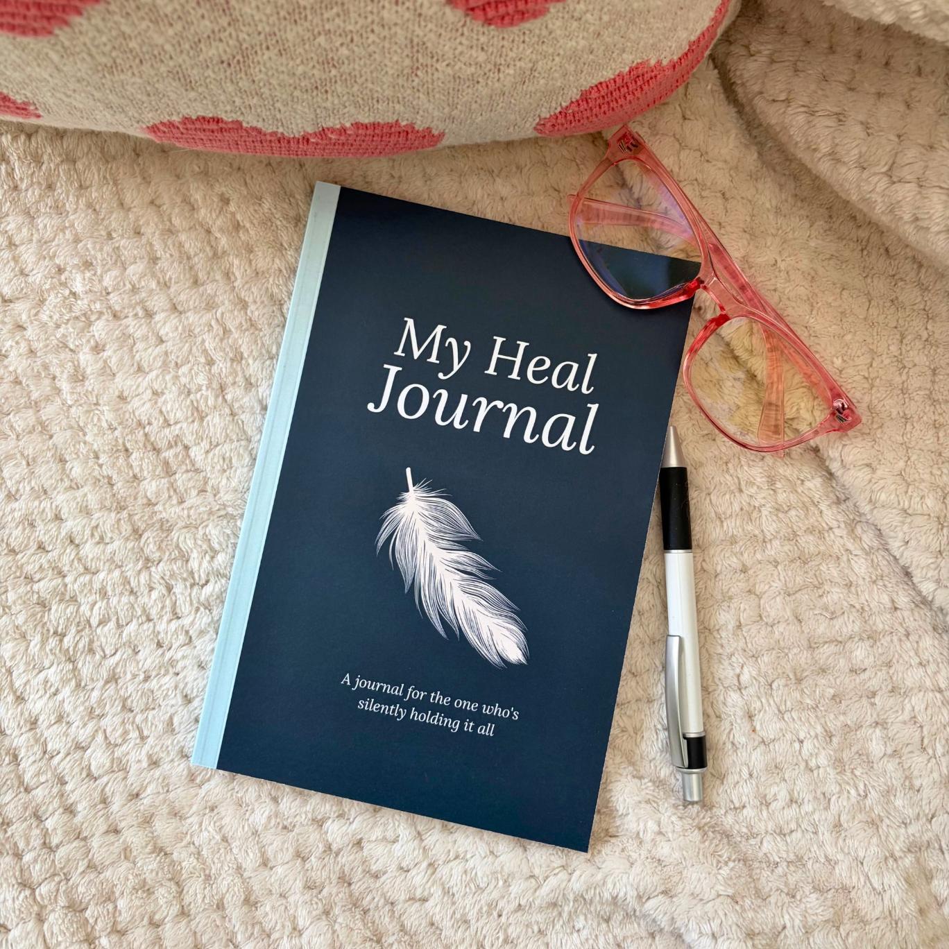 My Heal Journal physical guided healing journal on soft blanket with pen cozy lifestyle shot