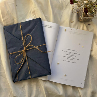 My Heal Journal physical guided healing journal wrapped in navy paper ready to gift